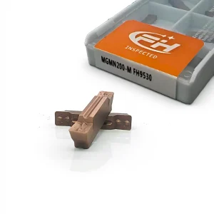 Carbide insert MGMN 200-M FH9530, front view showing two inserts with boxed inserts in the background