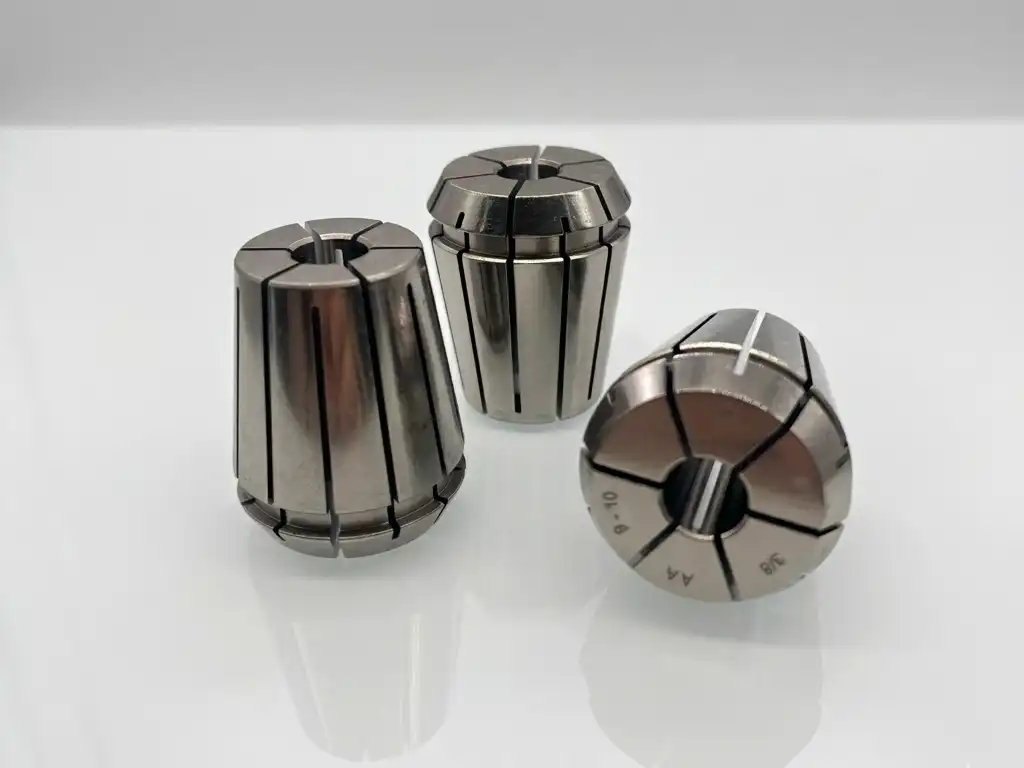 Three high-precision ER series collets for CNC milling and tool holding with industrial studio background.