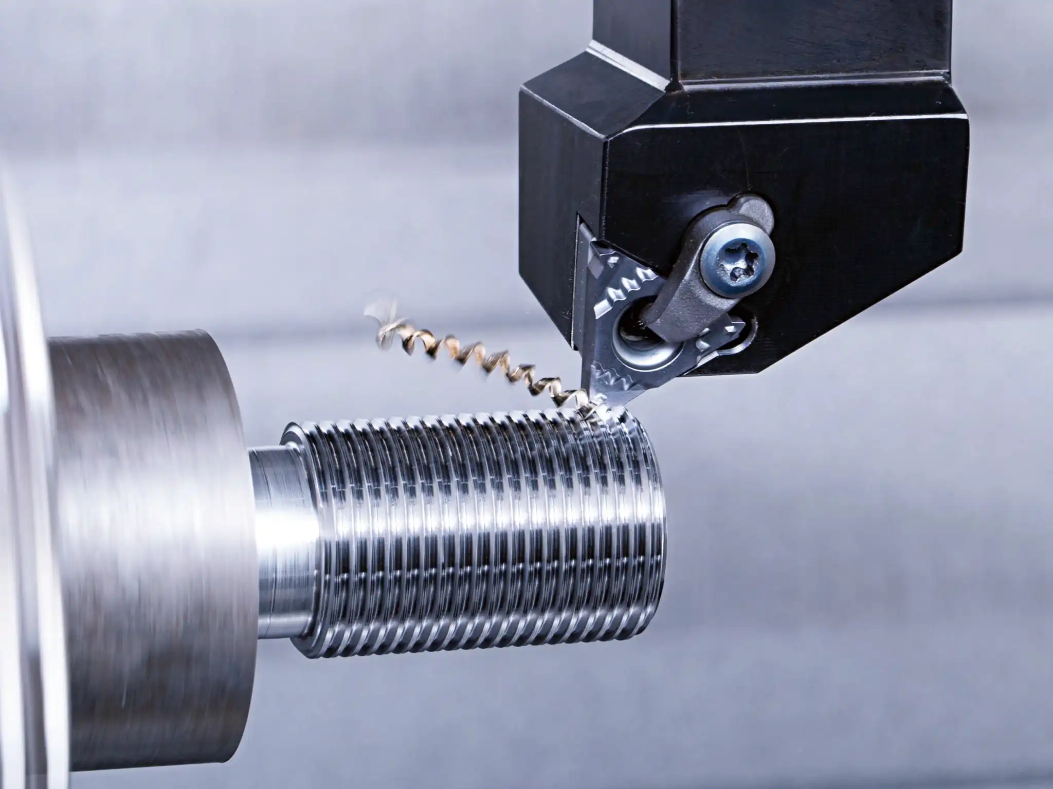 CNC machine performing internal and external thread turning with carbide threading inserts
