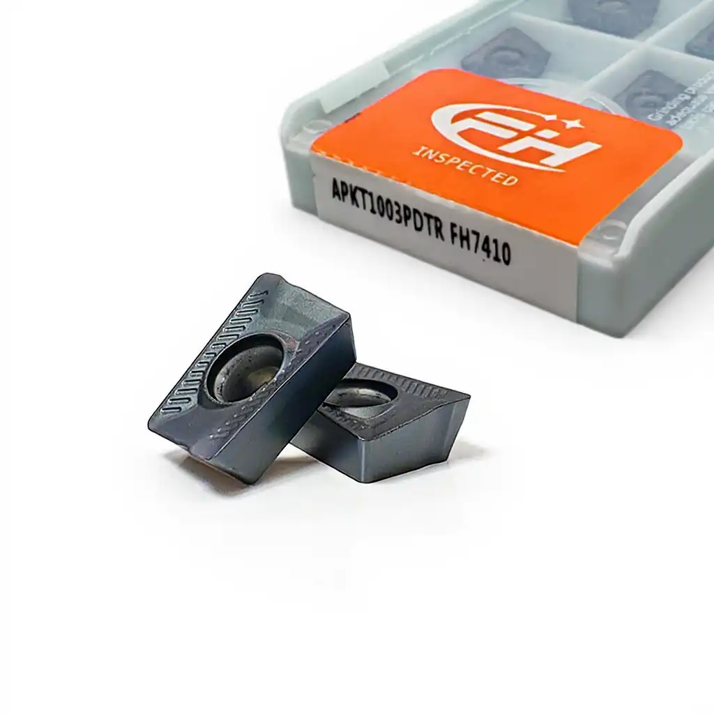 Carbide insert APKT1003PDTR FH7410, front view showing two inserts with boxed inserts in the background